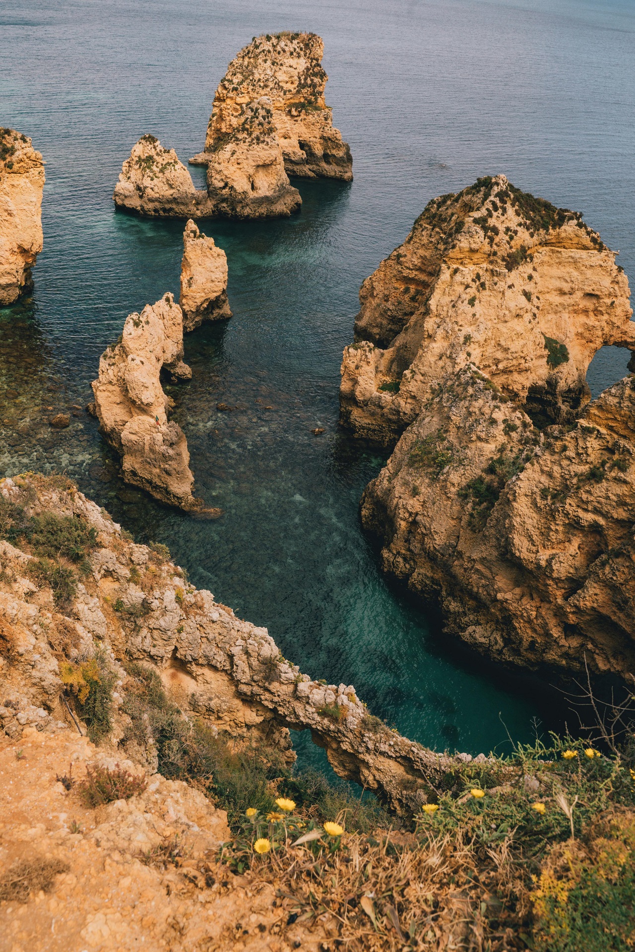 Dramatic golden cliffs, sea arches and turquoise waters at Ponta da Piedade
